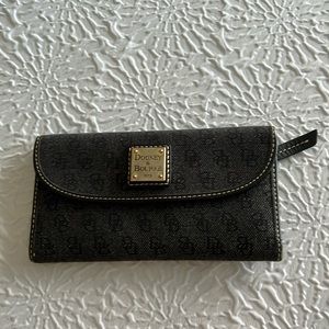 Dooney and Bourke monogram denim wallet. Red and black interior. Gently used.